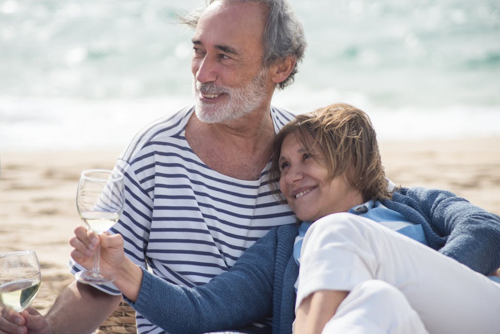 Senior couple smiling and enjoying on a sunny beach